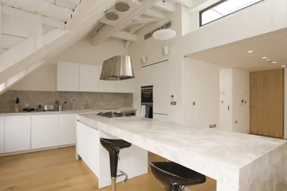 A modern, well equipped kitchen with breakfast bar