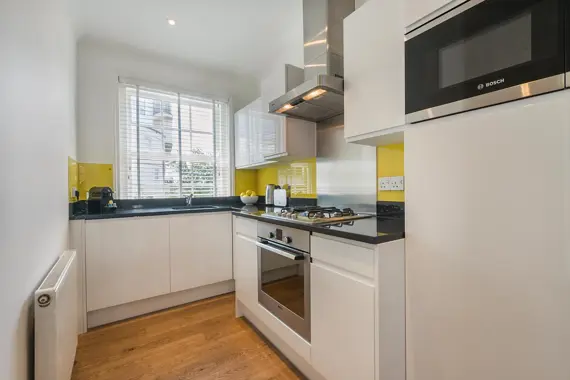 An open plan well equipped kitchen and dining area