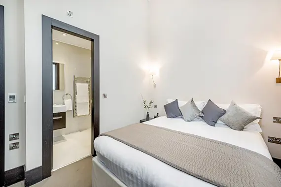 A bright, comfortable bedroom at 130 Queen's Gate