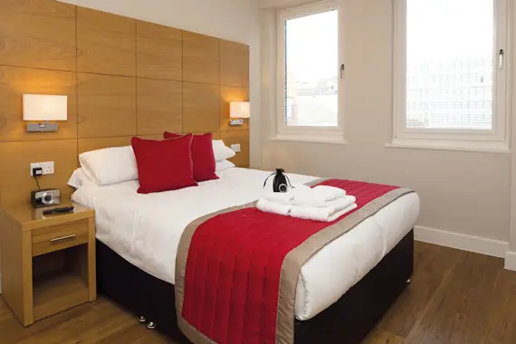 A spacious bedroom, filled with light