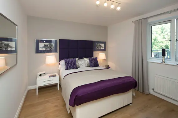 A well decorated, bright bedroom