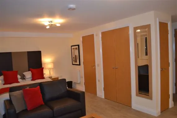 One of the studio apartments, with ample storage space