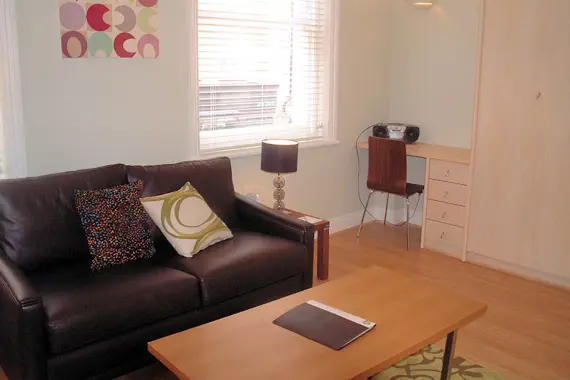 A comfortable living space in a studio apartment