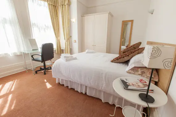 The bedroom has a handy work desk