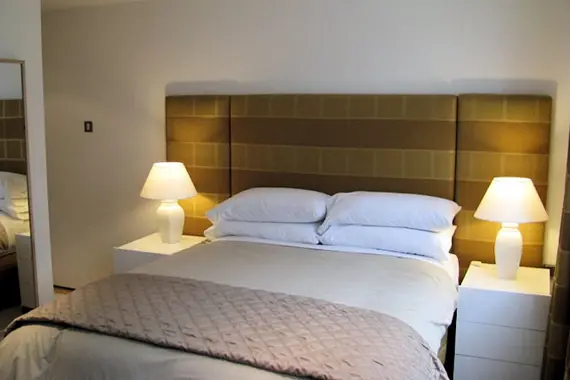 A cosy ouble bedroom in one of the two bedroom apartments