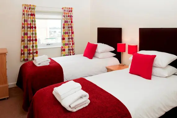 A comfortable and bright twin bedroom at Market Rise