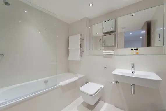 A stunning, sleek bathroom in the one bedroom suite