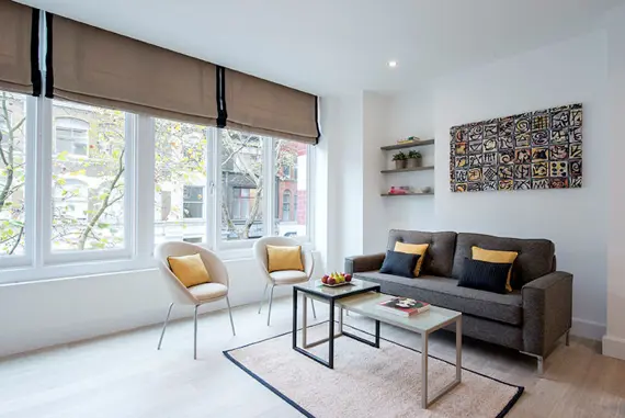 The modern, well decorated living area in a premier one bedroom apartment