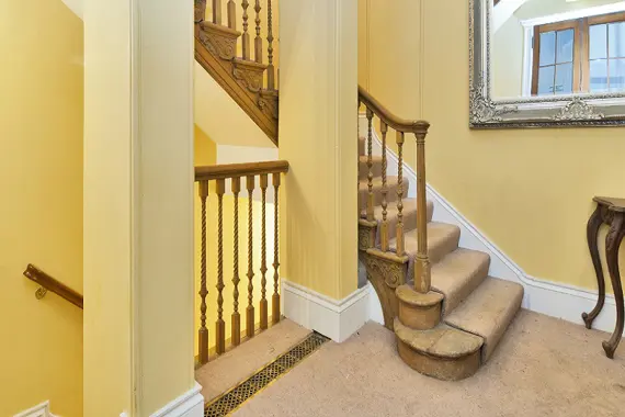 The luxury carpeted staircase at St Swithin's Apartments