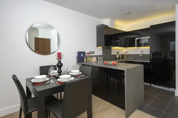 An open plan kitchen and dining area fully-equipped with up to date appliances