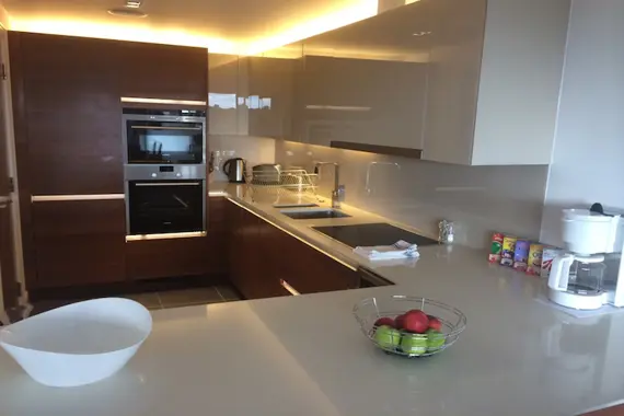 A modern kitchen at Kew Bridge Piazza fully-equipped with up to date appliances