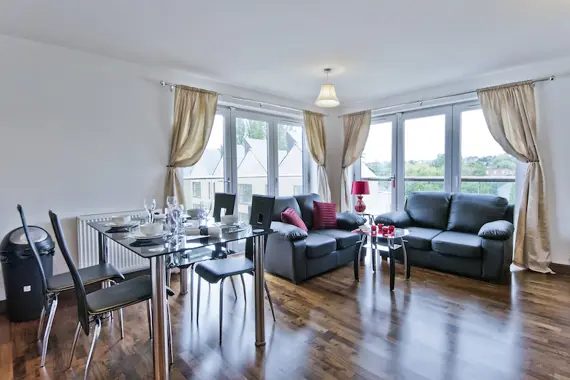 A bright and spacious living area at Kings Island with a modern dining table