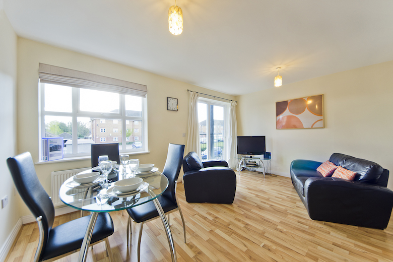 A spacious living and dining area filled with natural light