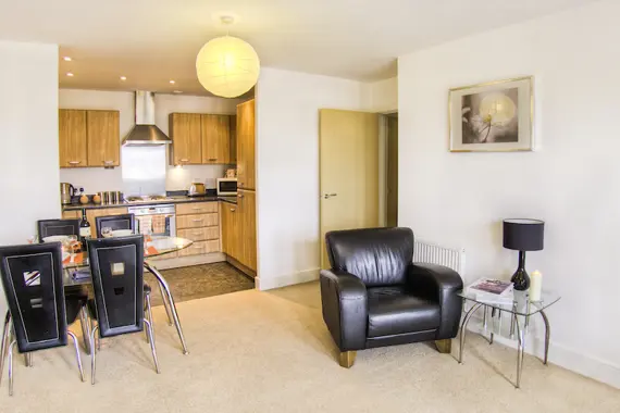 A typical open plan living area and fully-equipped kitchen