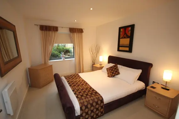 A spacious double bedroom in a one bedroom apartment