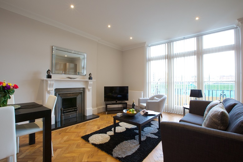 A warming fireplace at cosy West Kensington apartments