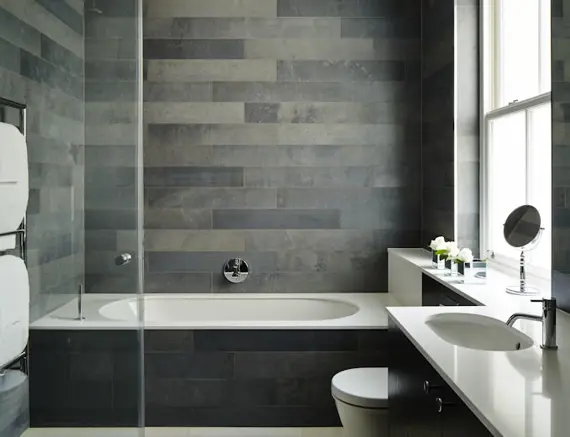 A marvellous, modern bathroom in a one bedroom suite