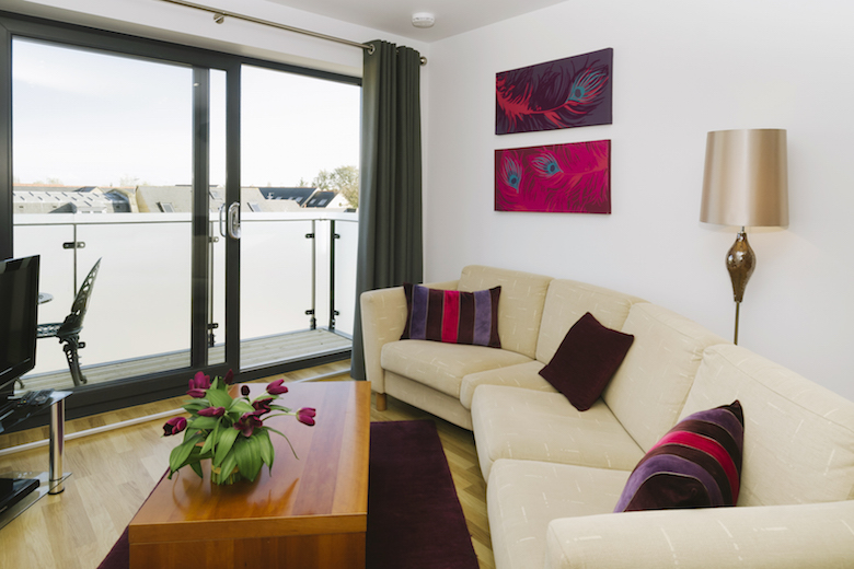 A spacious and bright living area at Eden House