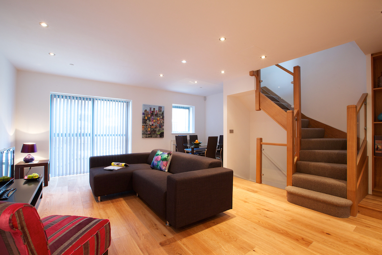 A modern open plan living area filled with natural light