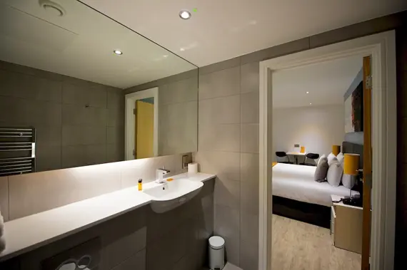 The large bathroom mirror in a Deptford Bridge apartment