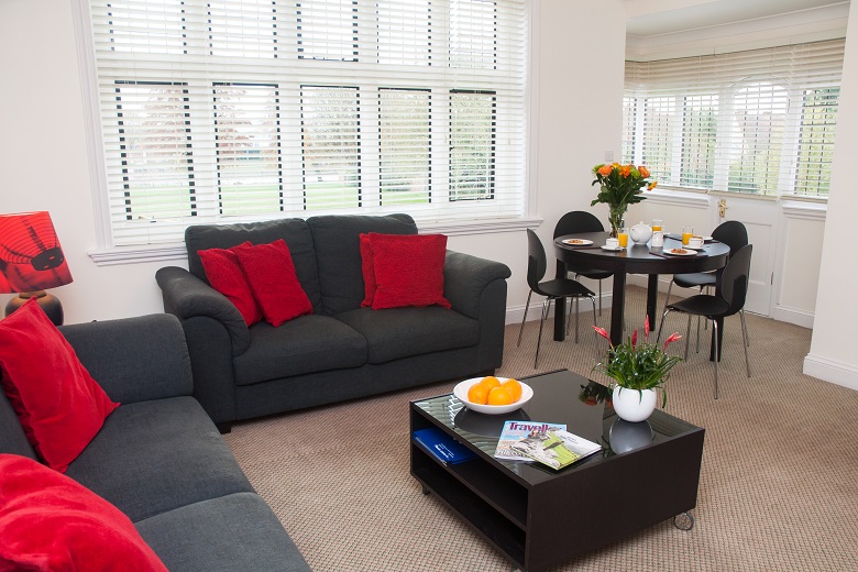 A modern and light living room in the three bedroom apartment