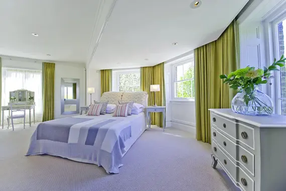 An absolutely beautiful, bright bedroom in the Court Suite