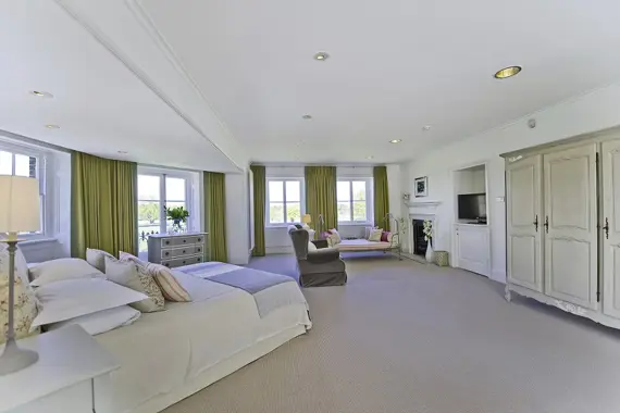 Another view of the stunning, light master bedroom in the Court Suite