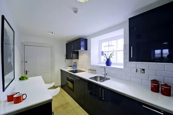 A sleek fully equipped kitchen in the Studio Apartment