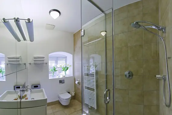 A very spacious shower room in the Court Suite