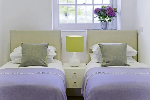 A pretty twin bedroom in the Lower Garden Suite