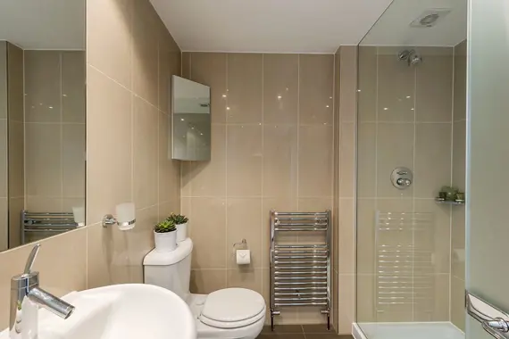 A modern bathroom with walk-in shower at 162 Gloucester Place