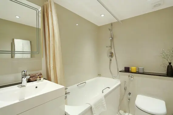 A stunning bathroom in a deluxe studio apartment