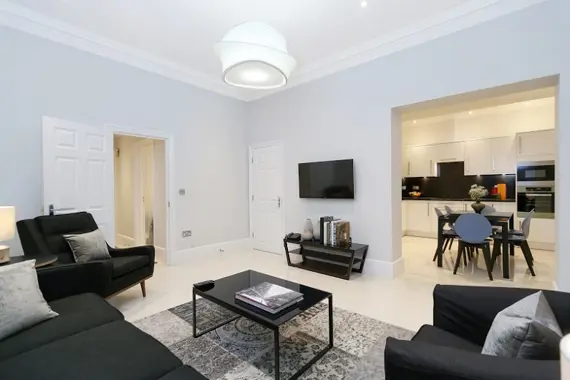 A modern, homely living area in a three bedroom standard apartment