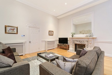 A spacious, grand living area in a deluxe two bedroom apartment