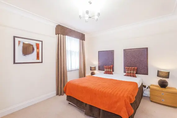 The spacious, bright second bedroom in the three bedroom apartment