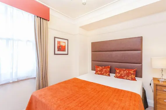 The third bedroom in the three bedroom apartment is still bright and colourful