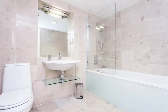 The clean, modern bathroom in the three bedroom apartment