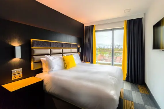 A Fukny, modern bedroom with a view