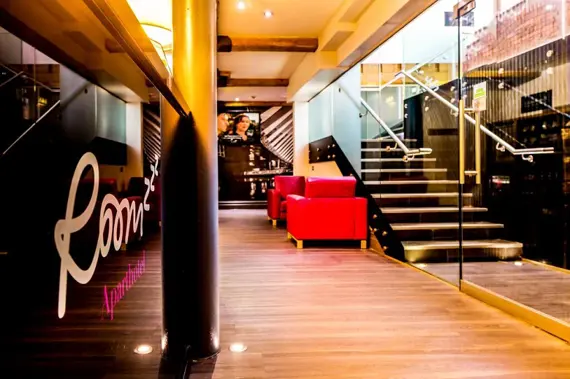 The colourful, welcoming reception at Roomzzz Manchester