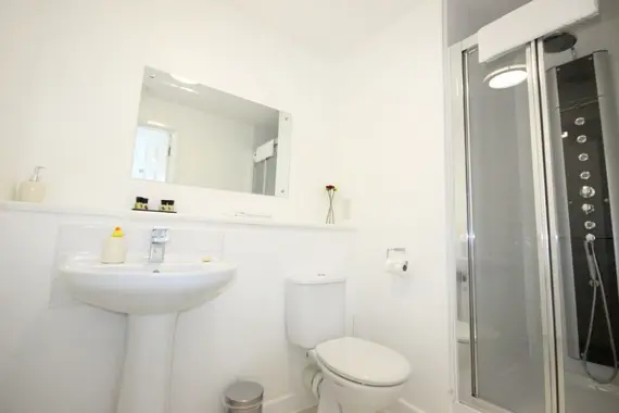 A spacious, modern shower room in a two bedroom apartment