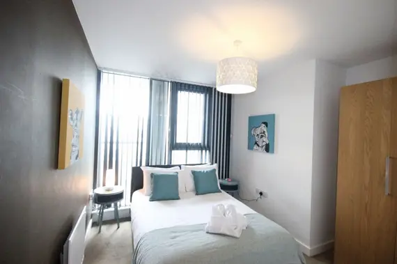 A cosy double bedroom in an executive two bedroom apartment