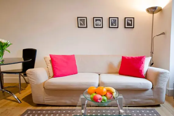 A cute, colourful sofa in a small studio