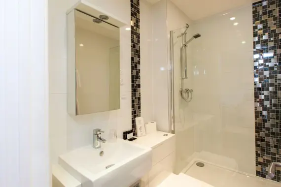 A sleek shower room in the standard studio