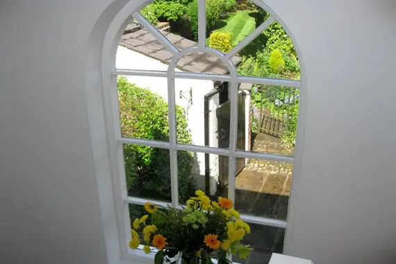 A cute window with a view of the garden